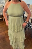 Although the band around the waist is a tad snug with no give, I was still pretty comfortable for the duration of my daughter's bridal shower. I did get lots of compliments on the color and style.  I absolutely love this dress. - Tricia H.