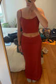 Super cute and nice quality, color was a bit more red than I thought. My main issue was the fit. I'm a 23b and 27 in pants, the top was a bit loose (not wearing a bra in photos, and the skirt fit me well through the hips but the waist was wider than expected so it sat below my belly button which I wasn't stoked about. - Casey N.