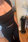 I ordered the small and the top was snug. The pants fit ok but were quite tight around my waist, and the crotch was long on me which didn't make for a flattering fit. I'm a 32B/size 27. - Casey N.