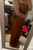 This is me trying it on quick out of the bag, it's not even all the way zipped. I like it a lot. The color is different, elegant looking. The orange is much darker than the picture online. Overall, it's a great dress. I plan on wearing it for a fall wedding. I'm wearing a 34c bra and I'd say I can just about get it zipped. It's snug. - Jenna S.