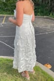 We had separate ceremony and reception days; ceremony was formal and the reception was at the backyard -white tent, linen-covered tables, etc. This fit the vibe perfectly. (pic while my hair was still drying) The fabric is luxurious and sturdy, and the corset back lets this adjust perfectly. I believe I adjusted mine all the way down almost as tight as it could go just to help with fitting rib size. Got a lot of compliments! - Victoria M.
