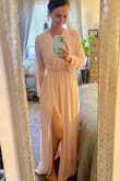 This dress is exactly how it appears in photos. The material is perfectly soft and light weight, and the dress really flows. It's not low cut at all - classy and sexy. Makes me feel like a princess! I am 5'8 and 140lbs - normally around a size 6, and M fit perfect! - Rachel M.