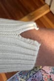I never actually wore this, tried it on once or twice, and the sleeve has already ripped. The cut is also much more cropped than it looks on the model, but it's also super wide. - Allie A.