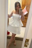 Love this dress. It's so cute. Has a girlie silhouette but it's structured. Not tight fitting, only at the top. Not see-through. Covers up my belly which is a plus! I got this for my rehearsal dinner for my wedding. Going for a city chic vibe. Looks really nice after you steam it and has a pretty structured satin look and feel! Excited to wear! - Kayla A.