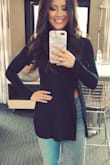 This shirt fits true to size and is the perfect balance of class and sass. The little slit shows just the right amount of skin to be sexy, but not over the top. I love that it is form fitting and so versatile. I wore this on a date night with my husband, but could be worn for many different occasions. - Nicole G.