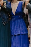 I purchased this dress for a wedding, which ended up being very rainy. It held up great in the rain! The fabric is beautiful. I had to steam it because it got really wrinkly in transit. I also sized down because I was worried about the straps falling off. The XS is a bit snug in the ribcage and there's no stretch to it at all. Additionally, the dress is SUPER low cut and I did not have time to get it altered or pin it prior to the ceremony. It's very plunging. I don't have much up top for any spillage, but those with a larger chest beware. - Tawny N.