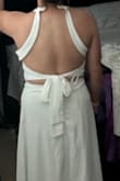 I love halter dresses and wanted to love this dress. I bought it as an option for my bridal shower but ended up returning it. Most Lulus dresses I think are made for girls that are 5'5" and taller. It would be nice if the middle part of this dress had a bit more give at the waist. Doesn't look good if you have a slight belly as you can see in the photo. Made for smaller girls. I ordered a size large. - Marissa M.