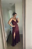 I got this and another dress and debating between the two to wear as a bridesmaid dress. The material is decent. It's a very light and airy dress and I really like that because I live in hot FL. The slit is very cute and not overly revealing. I'm not sure the top looks the best, but we'll see how it works out. Overall, I think it's a good dress! - Janine M.