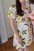 I wore this for my own (pretty casual) rehearsal dinner and will wear it again for a friend's wedding later this summer. It was one of the few dresses I found on Lulu's that didn't feel too young for me as a 30 something. I love the fabric and it washed and ironed well. It was thick enough to not feel revealing, but I did wear nude Spanx underneath. I had the same issue other reviewers had with the gapping top, and added a small sewn on snap that fixed it well enough. - Jessi P.