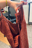 BE CAREFUL! This zipper busted as soon as I tried it on for the first time. Had my boyfriend go to zip me in and it busted. The entire back is now ripped down. I think this would have been a GORGEOUS dress and perfect for my friends late September wedding. But with such a faulty zipper I am not sure I want to order it again. The color is everything and the pattern is so pretty in the light. I wish I could show more photos, but I didn't get one of me in it before the zipper broke. - Karsen P.
