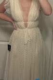 I was so excited to get this dress in for my bridal shower, but I was so disappointed to see how see through the bottom was. You could totally see my legs through the fabric. It could work if someone added a slip underneath, but I didn't want to add another layer! Otherwise the dress is so cute and I love the Swiss dot pattern. - Megan P.