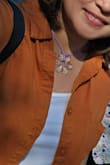 Color is nice, same as the photo. I love the fabric; it's not thin. However, it is a bit long for me like a tunic. - Irene C.