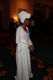 I wore this dress to a banquet with my headwrap and received so many compliments. I was told I looked like a an African Goddess, A Queen, a Woman of Elegance. All of which are  true! Haha! This dress is very, very long. The material is thick, sort of like a heavy sheet. I wore a white camisole underneath because i didn't want my chest out.  I really enjoyed this dress, it's definitely a statement peice. Can't wait to wear it again. As long as you have confidence in yourself you can rock anything!!!!! - Lakeisha H.