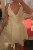 I loved this dress. It had a little cleavage and cute back. If flared out so I didn't feel self conscious of it being too tight around my stomach (after drinking and snacks lol). Was so perfect and would wear again. - Alana P.