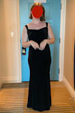 I wore this dress to a formal wedding and it worked great. The materials is thick enough to feel secure, but not too heavy to be uncomfortable. It's made out of some sort of synthetic material that (very usefully) keeps it from wrinkling when rolled up tight in a suitcase. I had one issue with it, which was the shoulder situation. It's an open back dress, so the shoulder straps are looped by both ends to the front of the dress. I have rather sloped shoulders, so these loops were at high risk of slipping off, and did if I moved too vigorously. I shortened the loops and used fabric tape, which fixed the problem well enough. - Bea C.