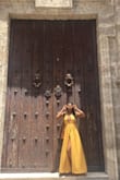 I wore this dress in Cuba and it fit right in with all the colors! The dress is gorgeous and it makes for a great photo op!! Definitely hang to dry because it did shrink up on me a bit and I have long legs. - Ashley A.