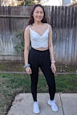 A cute cropped top for summer. The quality is nice and the straps are adjustable. It is more cropped than some of my tops but pairs well high waisted bottoms. The top is stretchy. - Maiseely T.