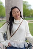 Love this shirt. It's cute and warm. Love the fringe at the bottom. The sleeves are a perfect length. If you live in cold weather, I would suggest layering. It is a little cropped due to the fringes. - Maiseely T.