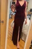 As bridesmaids, we were given a few directives. She picked our colors, velvet, and floor length. I like the dress and am pleasantly surprised it fits so well. I only have two issues. On a lot of the pics (both model and fellow reviewers), the slit is on the side, which I would prefer. On mine and a few other pictures from reviewers, it's in the middle. Is this a factory defect? Additionally, I might have liked it to be a little deeper of a v-neck? I like the look of flatter people (such as myself) with deep v cuts, but honestly, it's a great dress. I just need to figure out how to squish my boobs inward so it looks like I have some, haha. I was given the "that looks great on you," but maybe it's meant for a different body type? I don't know, regardless, I like it. - Lourdes H.