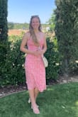 Cute dress, nice light material that lays well. I did have the front come untied when I accidentally caught it but I just knotted it before tying the bow and then it stayed together through a night of dancing! - Erica W.