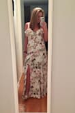 I'm normally between a medium and a large on Lulus 
I wasn't sure what to expect with this dress but it's gorgeous. Very loose fitted but still flattering. Got a lot of compliments and stares when i wore this out to a nice dinner
Dress gets wrinkled very easily though. - Elle H.