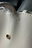Bag is gorgeous until you actually use it. After a few uses, bag is tearing at every strap and stitching is unraveling. Unfortunate waste of $50 as was only to use a handful of times. - Carmen F.