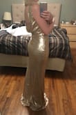 This dress is gorgeous in person. It's thick and well made and fits perfectly. It looks like it is expensive and high end. I feel like a movie star in it and can't wait to wear it to my fiances company party! - Heather B.