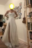 It's such a great dress at a great price! Ran a little tight in my experience. But it's great. Probably need to tailor a bit (suuuuuper long). And I think the fabric may need some wrinkle reducing. But it's a real wedding dress for a real good price so I recommend it. The fabric is a little hot. And the zipper had some issues. But it's a 4.5 dress (can't do half points). But it's a 5 given the price. - Sarah S.
