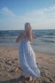 I bought this for an engagement photo sesh on the beach and it was perfect! The back is adjustable so I could make it as tight as I wanted. - Sarah H.