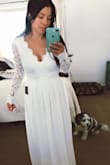 I ordered this dress for my simple and intimate upcoming wedding. I'm in between sizes in most purchases but decided to go with a medium. I'd def say this dress runs true to size. The waist has no elasticity so be aware of that when we deciding/when you measure. Gratefully it fit albeit very long and a bit loose in the shoulder area for me. Nonetheless it can be easily fixed with a few alterations. In the grand scheme of things its a steal with the price considering what some other dresses cost. The quality is great. Overall I really like it and I know it will be perfect once I alter it a bit :) - Natalie G.