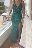 This dress is WAY more teal (dark teal) than in the photos. I was hoping for a darker pine green/green black, but this was not it. The fit was great, but it was more of a prom color than black tie event. - Meredith M.