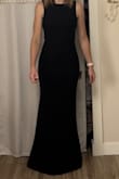 This dress is great for a formal event. The back is beautiful, and the front is perfect for small-chested ladies! I have difficulty with sizing, as my bust is XS, waist is S, and hip is M/L. I ended up going with the size small, and it does fit. The waist is a perfect fit. It is stretchy enough to accommodate my larger hips, though my thighs do feel like they are squeezed together. It fits great at my bust with or without a bra - I have tried many other size small dresses and all have been too large for my bust. Overall, it gives the classic and feminine vibe I was going for. - Kaitlyn G.