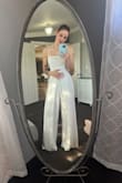I loved everything about this jumpsuit!! It's fitted on the waist and loosely fitted waist down. It has a flowy touch to it that makes it more sophisticated & gives it a dress appearance. I wanted something lightweight for a July Elopement & this was everything I had envisioned for an intimate ceremony. It made me smile when I tried it on so I knew it was the right pick. - Isabel A.