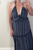 This dress is amazing!! I am a 34G and I often wear a medium and dresses, but reading the reviews that said it ran big. I ordered a small and it's perfect. - Missi T.