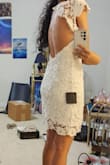 Has a weird fit in the back with the lace pattern. It feels too loose. There is also a button up top which is always annoying to hook in any dress. The fit on the waist/hips is really nice but the chest area was too big for me (28B size). It also is a very rough material, the lace isn't soft. It's very thick and made of thick thread so it's not the most silky and soft to wear and when bending a little bit or even walking or raising your arms, it does a weird pokey triangle thing that you can see in my second picture.

I returned this. - RISHITA P.