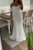 I really like this dress. I'm shorter so even with heels on it was a little too long. I would get alternations on it and pin the back a little move to give a tighter train look on the back. But other than that very pretty & I really liked it. - Kara D.