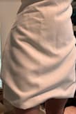 I bought this dress to wear to work, but I couldn't even get it over my hips. So, since it was a final sale, I let my friend try it on and she said it didn't look like the picture because it was like a bubble dress at the bottom. - Sarah O.
