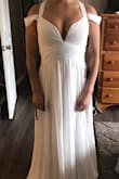 It was a beautiful dress! I was debating using it as my wedding dress but I went with another dress from lulus. Material is very light and flowy. Quality is great! I would have needed alterations. Same as everyone else, shortened the length and straps. - Maricela M.