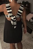 The material was nice and it wasn't too long or short. Got lots of comments. I just had a lot of difficulty figuring out how to tie the bow. It will show your back fat if you are self conscious. - Jessica G.