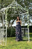 I recently wore this stunning dress to a wedding in the picturesque French countryside and felt absolutely magical. The lush floral pattern and flowy tiers danced beautifully in the breeze, creating a truly ethereal silhouette. Although the dress arrived with a slight tear at the bottom, it was a blessing in disguise, as I had planned to shorten it anyway. The adjustment was minor, and actually enhanced the dress's charm, allowing me to show off my shoes and move more freely throughout the evening. This dress was a head-turner and made the night unforgettable. I received loads of compliments. Highly recommend it for anyone looking to add a touch of romance and sophistication to their wardrobe! - Sophie K.