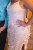 Wore this to an outdoor wedding, and it was beautiful.  The 3D flowers looked lovely in the sun.  I didn't have to adjust it the whole night, and I danced a lot.  Adjustable straps were sturdy, and I wore a strapless bra, as the top was a little big on me...hugs your curves. I have a butt so I went up a size.  It hit me around the mid-calf. Loved it! - Kristin S.