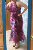 The dress has two layers. The inner layer is bright pink and stretchy. The outer layer was not stretchy at all, and plasticy. It was too long for me, but seemed okay until I tried to put on my shoes and the seam ripped almost 6 inches along the hip. The fabric shredded so I couldn't get it repaired. It was disappointing. It hadn't seemed tight but tore like piece of paper. I was going to wear it for a wedding, but had to find something else. The bride had picked this out and was NOT happy. So, if you buy it, be careful! Don't bend over. (And you probably want to be taller than 5'2".) - Jacquelyn S.