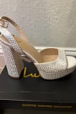 I bought these to wear for my wedding day! I'm usually a 6.5-7, size 6 fit me just right. Perfect since my fiancé is a lot taller than me and these heels are instantly comfortable! My dress has pearls on them so I love that they aren't a true white and the pearls are a nice touch. The price is better than most I found similar, can't wait to wear them with my second dress too! - Nikki C.