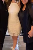 I wore this dress to my bridal shower. Loved the length, and the halter-esque top. I felt it was very flattering on my figure. I'm tempted to make a purchase in other colors. Highly recommend! - Jill K.