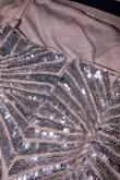 Not white as in photo, $20 on sale ok. background is beige/pale pink with silver sequins. Weird. Would have been nice if the photo matched the dress, but for $20 final sale, I'm stuck. And well... Only $20. I can probably sell it and the buyer will pay shipping via ebay - Dianne R.