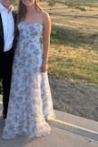 Absolutely loooved this dress! I looked super expensive and perfect for spring or summer wedding. I wore size M. Bust was too loose but I just safety pinned it to my strapless bra. I will probably get it tailored so that I can wear it again! I'm 5'7 and wore 3 in heels and it still got dirty from dragging, so I'll probably get it shortened also. - Alexandra L.