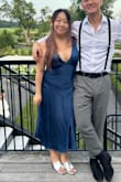 Very pretty dress, the back needs to be folded out though to look cuter. Material is very nice and felt comfortable all day :) I'm also a short gal but the length of this dress was just right and didn't need any hemming. - Grace K.