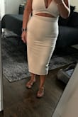 Comfortable stretching fabric! I wore it with a sticky bra that clipped up front, some spanks shorts and that worked perfectly. - Minnie F.