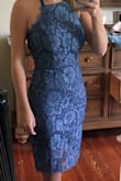 I wore this dress for a wedding in CA and it was perfect! I actually typically order a small but they were out of smalls when I ordered so I took a chance and ordered an XS and so glad I did! I think because it was tied in the back, I was able to made the XS work! You'll definitely need to wear sticky boobs or something if you have a little bit of a larger chest (i am a 34C and I wore sticky boobs to the wedding, but not in the picture attached). The dress is tight but comfortable and very flattering. The slip under did ride up a little bit but that was expected! Super cute!! - Samantha N.
