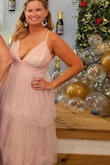 I had tried on SO many dresses for an upcoming wedding and none were "that" dress. I found this one about 2 weeks before the event and I didn't even look in the mirror when I put it on - I just knew it was perfect! The material is so light and flowy! The wedding ceremony was outside in about 98 degree weather on the East coast , so very humid - and I was not uncomfortable one bit. The straps on the back are adjustable, which is super helpful to keep your bust inside the lines. Being on the shorter side at 5"4, the dress was long, but nothing a good pair of chunky heels couldn't help! I got so many compliments on this dress - Looking forward to being able to wear it to another event! - Jessica F.